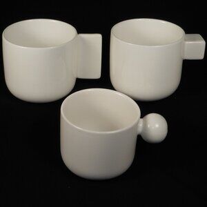 3  beautiful Coffee Mugs. oui white weight porcelain